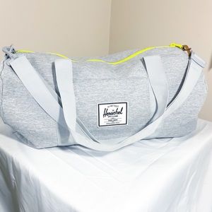 Herschel light gray duffel bag neon yellow zip red stripe lined 15” x 21”